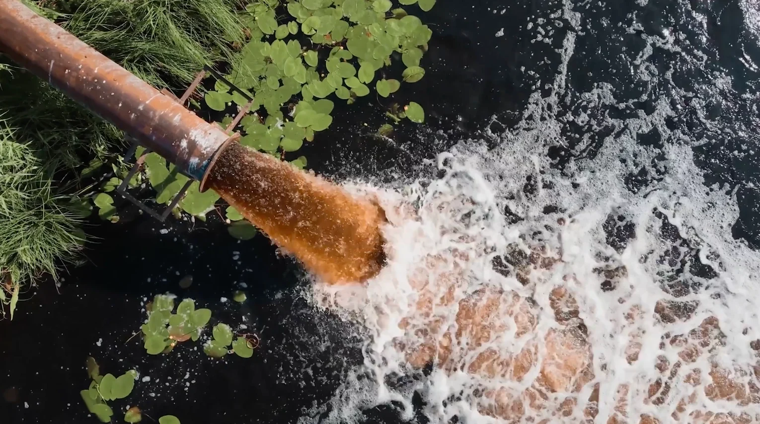 Pipe with sewage entering the river