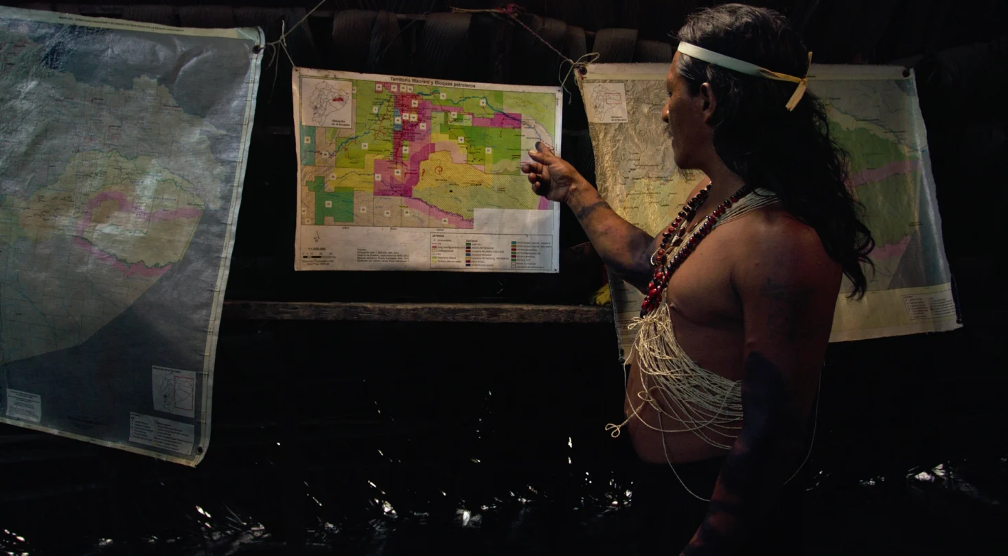 Man from the Yasuni tribe showing a map of the region