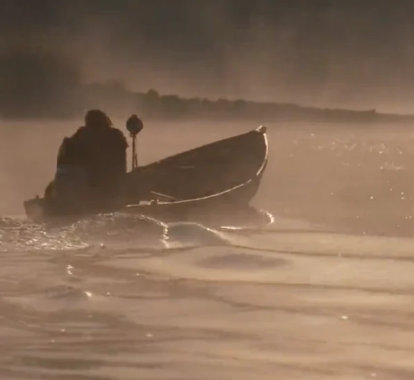 Man in a boat on the water