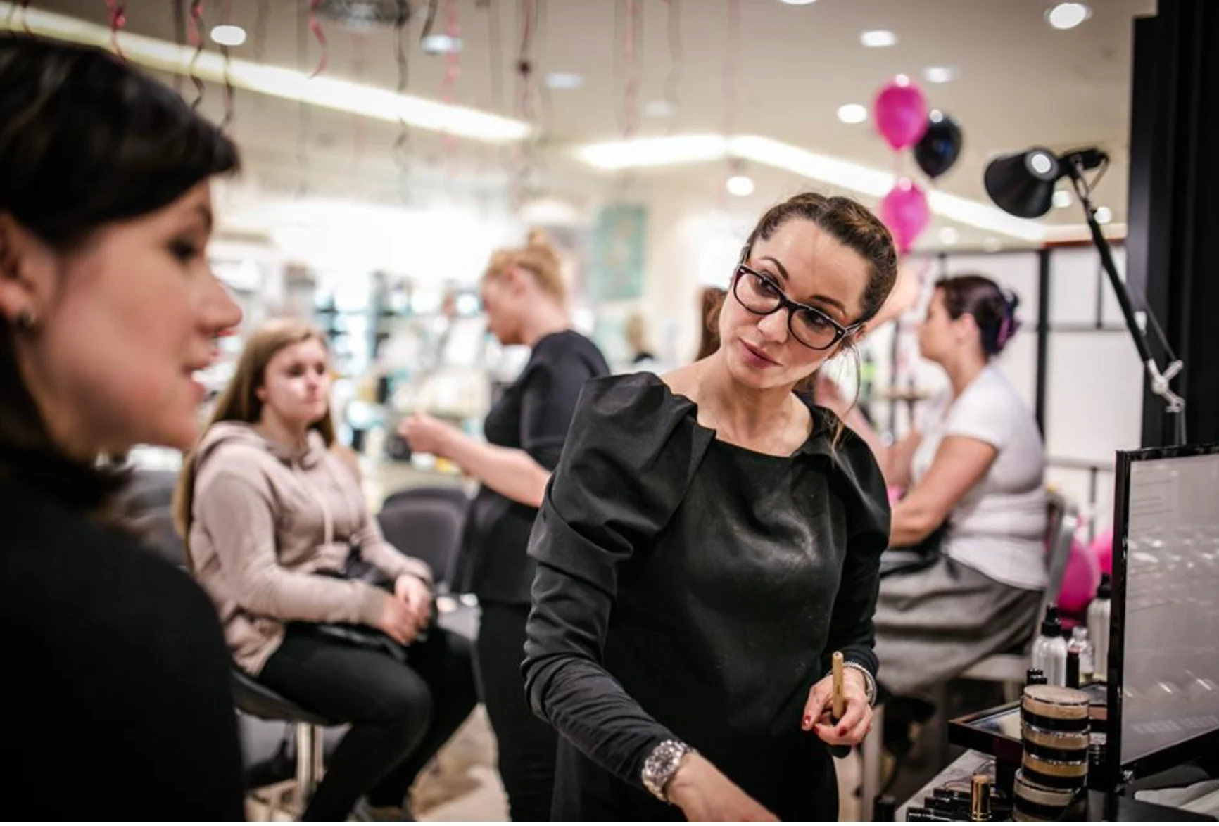 Magda Atkins working as a beautician, makeup artist